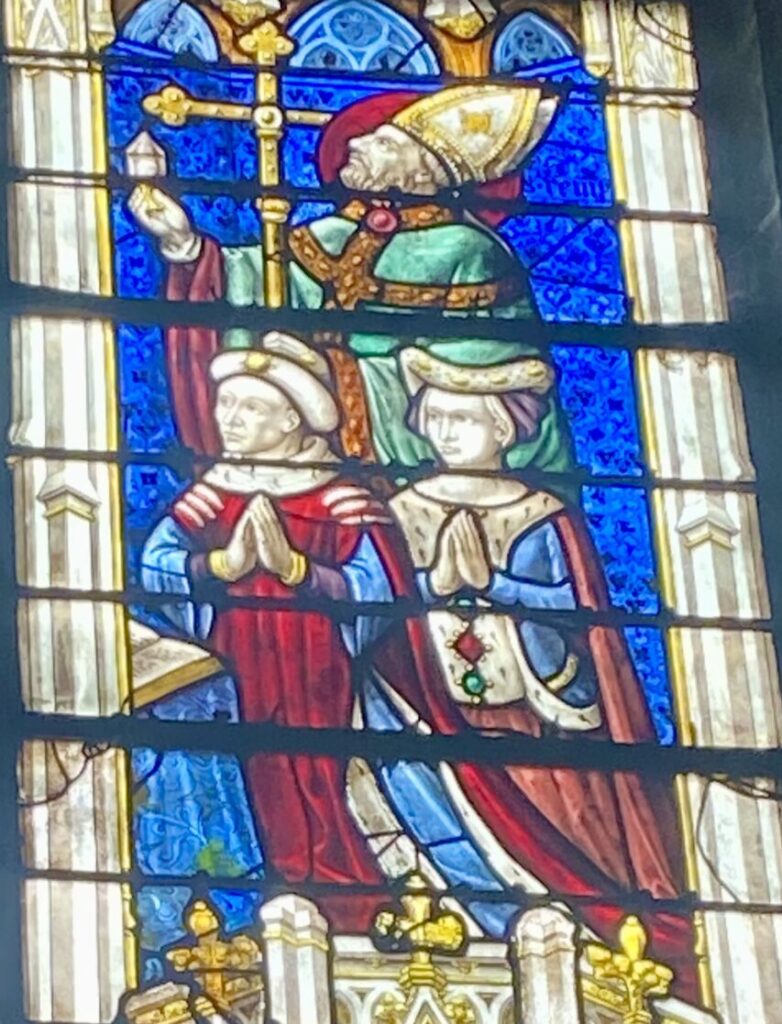 A close up of Charles de Bourbon and Blanche de Roucy in the stained glass - Chartres, France